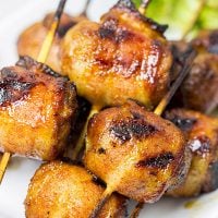 Whether in your backyard or at a picnic in the park, these Bacon-Wrapped Brats are perfect for summer grilling!
