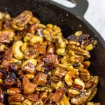 Looking for a fun and unique holiday appetizer?  These Maple Glazed Nuts with Candied Bacon are salty, sweet and delicious!