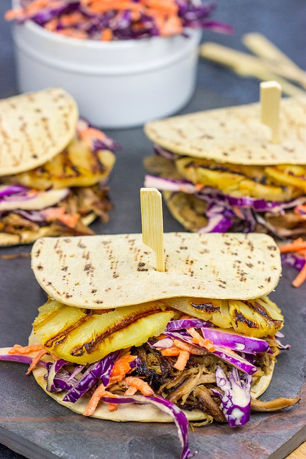 It might be summer, but let's pull out that slow cooker!  These Slow Cooker Hawaiian Pulled Pork Sliders are an easy and delicious way to feed a crowd!