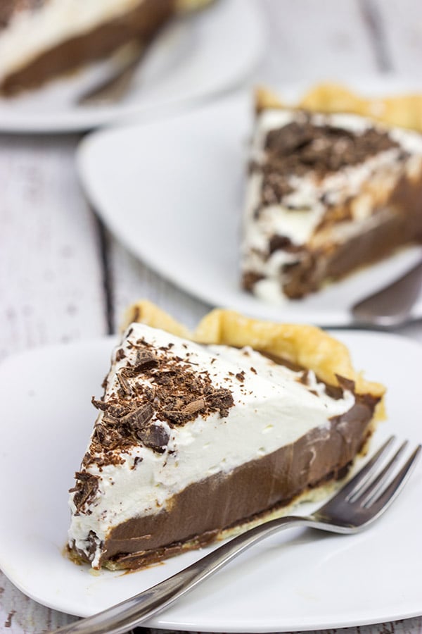 This classic Chocolate Cream Pie recipe features a silky smooth chocolate filling topped with creamy whipped cream.  Sprinkle some shaved chocolate on top, and you've got a delicious dessert to share!