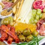 A Holiday Charcuterie Board is a great addition to any holiday party.  Here are some and tricks for turning your cheese board into the talk of the party!