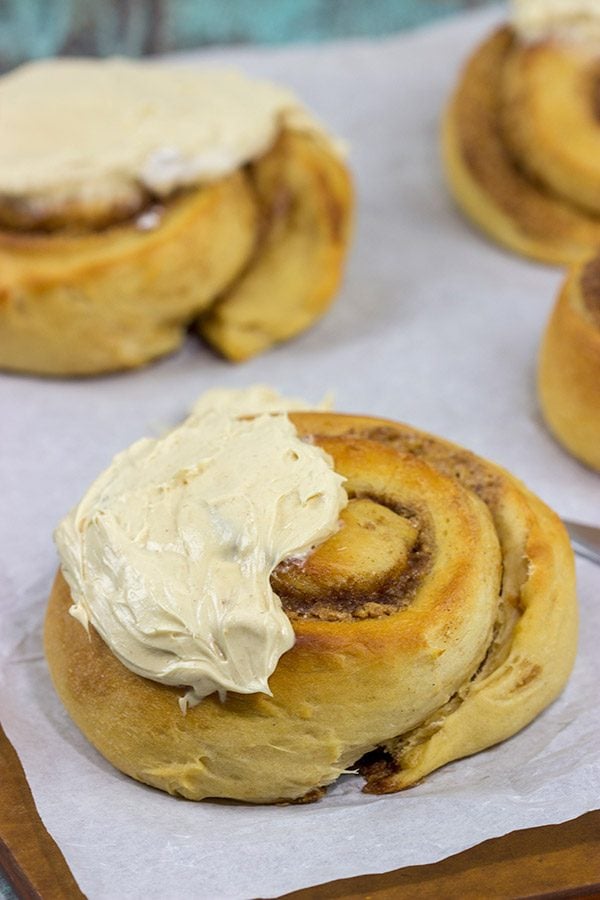 Peanut Butter Cinnamon Rolls Topped with whipped peanut butter frosting