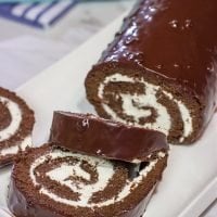 Filled with creamy whipped cream, this homemade Swiss Cake Roll is just like the one ate as a kid...but better!