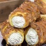 Trdelnik is a unique cinnamon sugar pastry found throughout Prague.  Often filled with whipped cream and Nutella, Trdelnik are a delicious sweet treat!