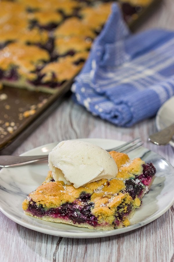 Looking to feed a crowd for a summer picnic?  This Blueberry Slab Pie with Sugar Cookie Crust is a tasty answer!