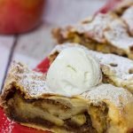 This classic Apple Strudel features crispy pastry dough filled with cinnamon, apples and rum-soaked raisins.  It's a delicious way to celebrate apple season!