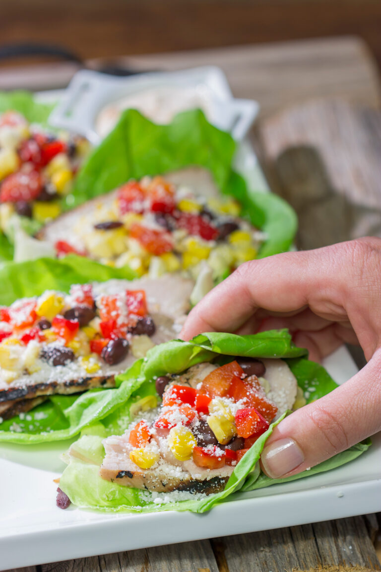 Filled with thinly sliced, marinated pork loin, grilled corn and chopped peppers, these Southwest Pork Lettuce Wraps make for a tasty gameday appetizer or meal!