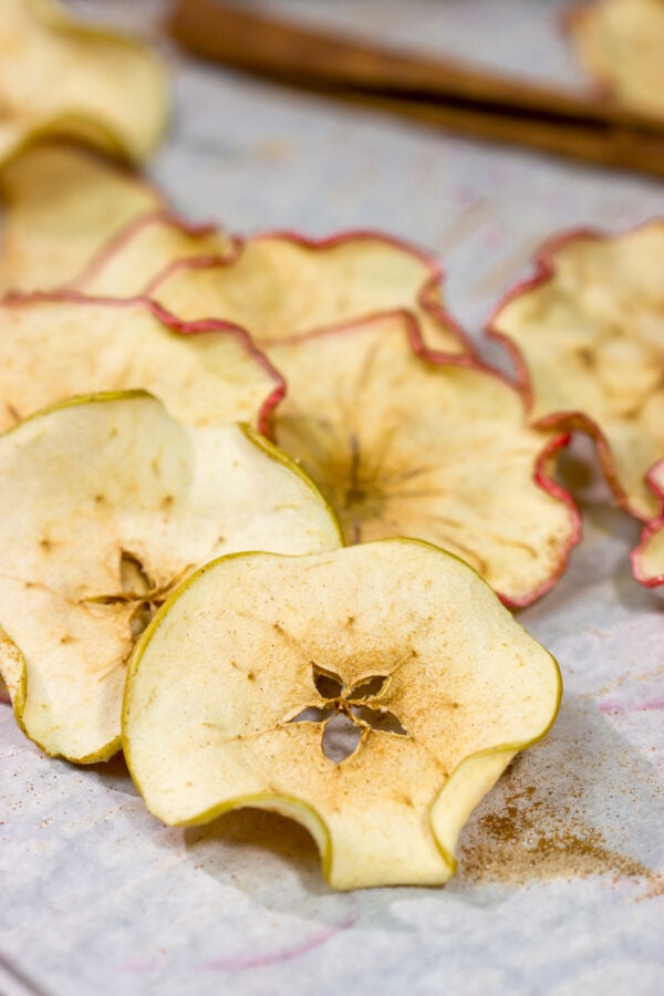 Lightly dusted with cinnamon and sugar, these Oven Baked Cinnamon Apple Chips are an easy (and healthy!) snack. Bake up a batch today!