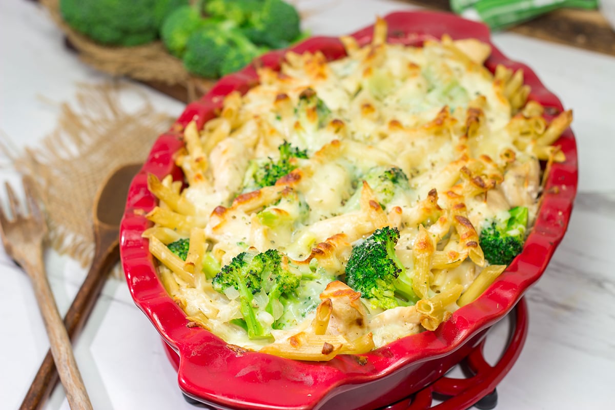 A classic, golden-brown cheesy chicken and broccoli pasta bake straight out of the oven