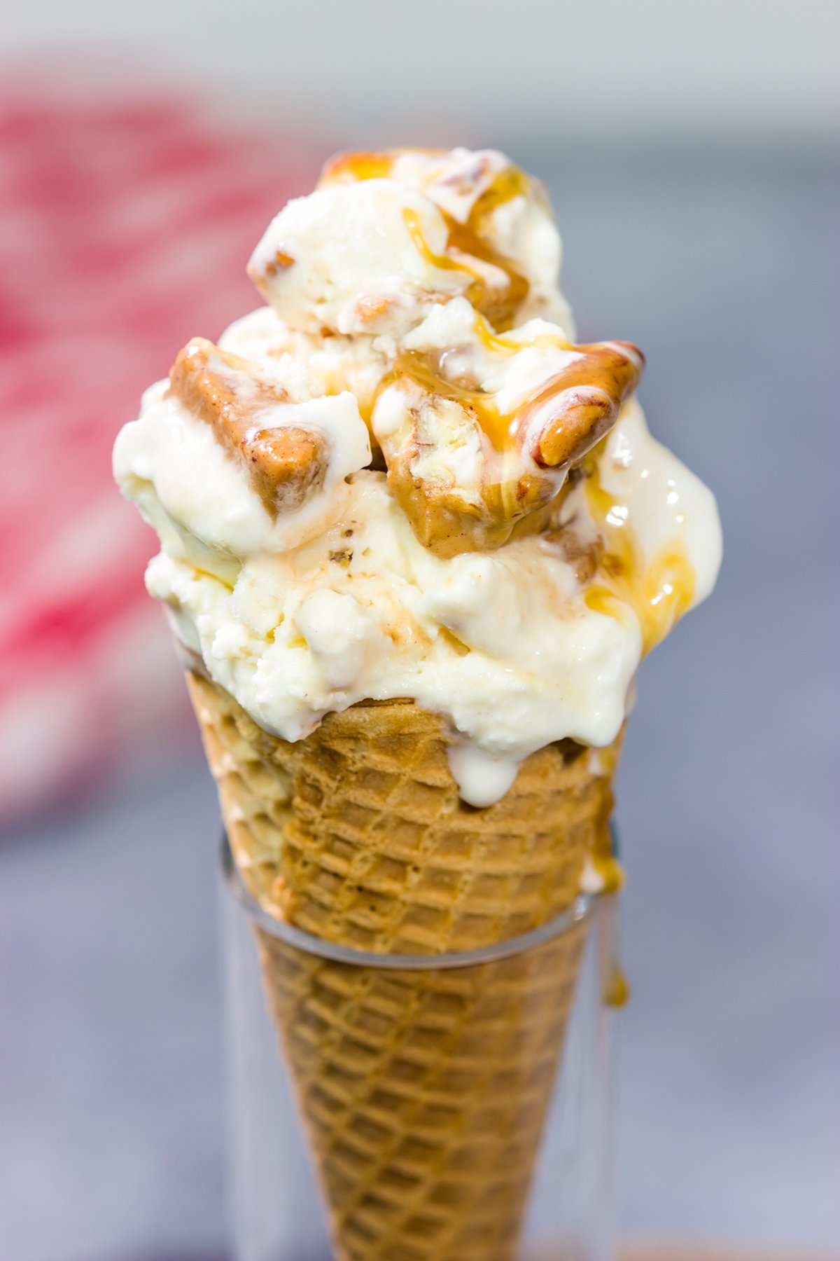 This Caramel Praline Ice Cream features a creamy vanilla base filled with nutty crumbled pralines. It's delicious, and it's perfect for a hot summer day!