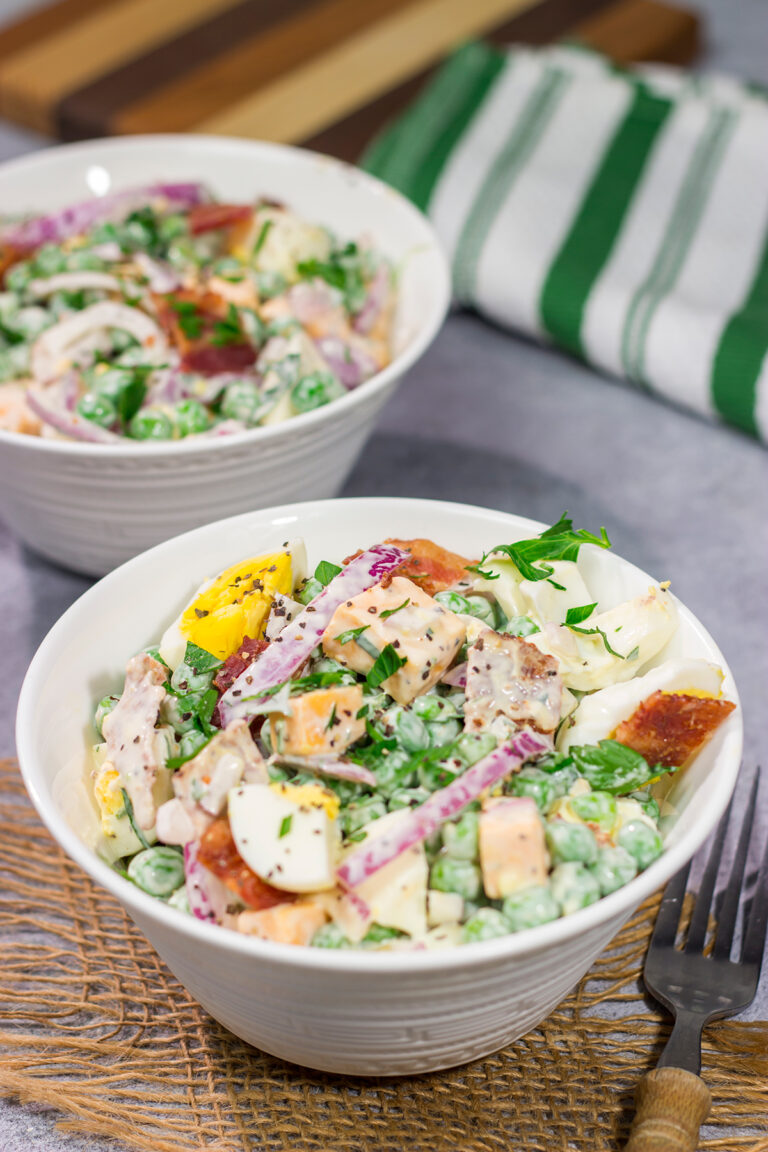 Packed with bacon and cheese, this Easy Pea Salad is a colorful and delicious side dish for summer meals and potlucks!