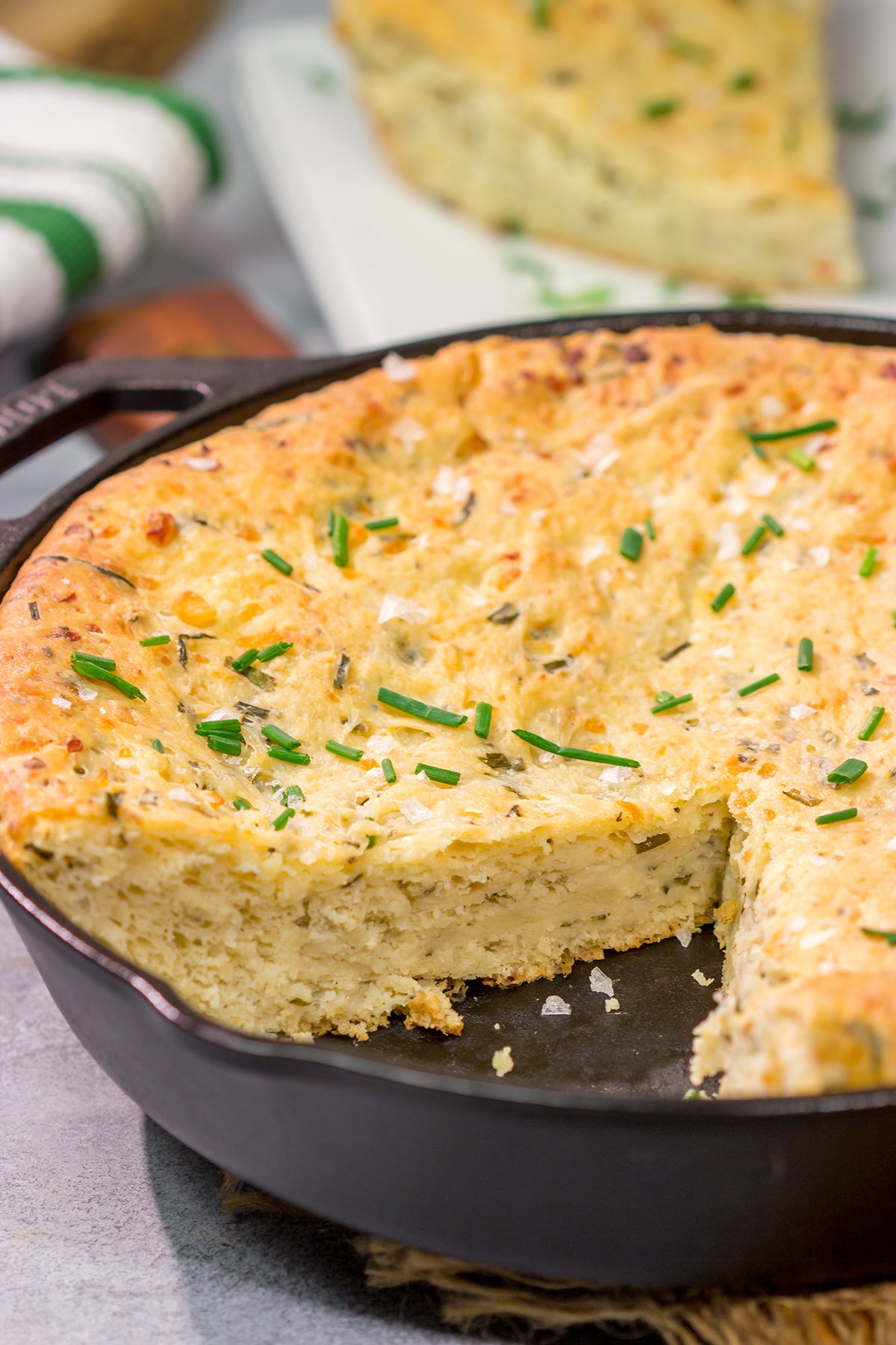 This Cheesy Chive Bread has incredible flavor! This skillet bread is a great side dish alongside a bowl of soup or chili.