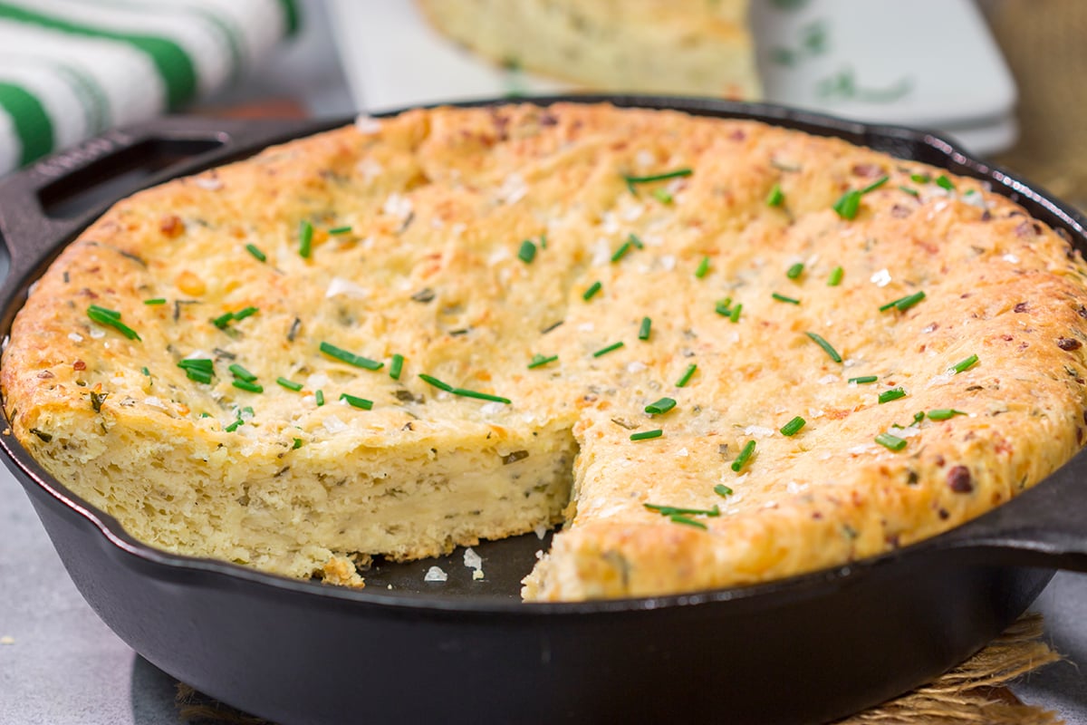 This Cheesy Chive Bread has incredible flavor! This skillet bread is a great side dish alongside a bowl of soup or chili.