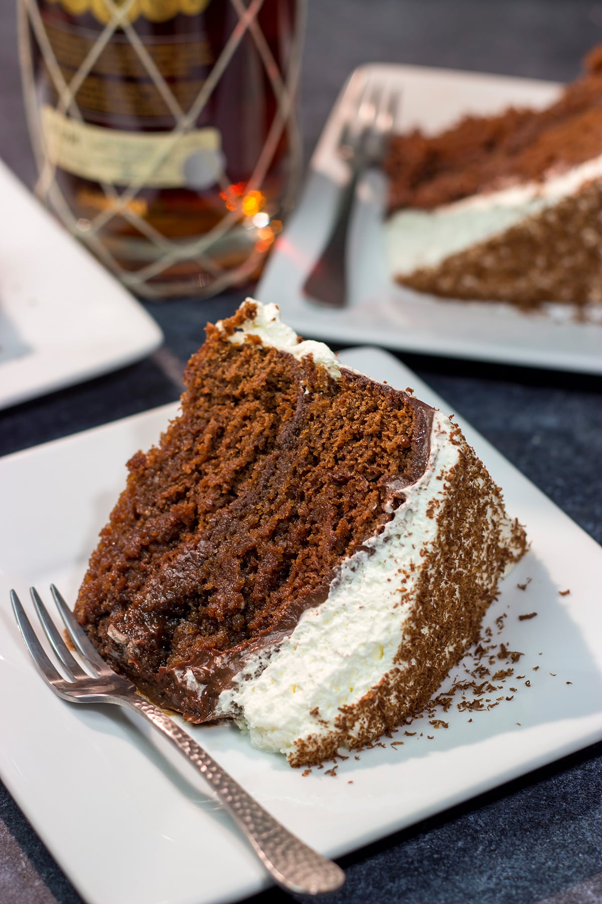 Featuring layers of chocolate cake soaked in rum, this Chocolate Rum Cake tastes just like rum balls. It's a great dessert for holiday entertaining!