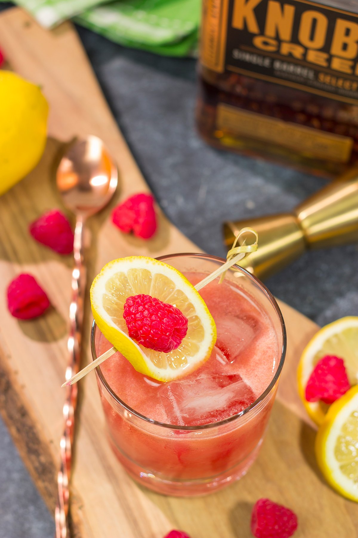 This Raspberry Bourbon Lemonade is a great summer cocktail! Made from fresh raspberries and real lemons, this whiskey cocktail is great for parties in the backyard. Cheers!