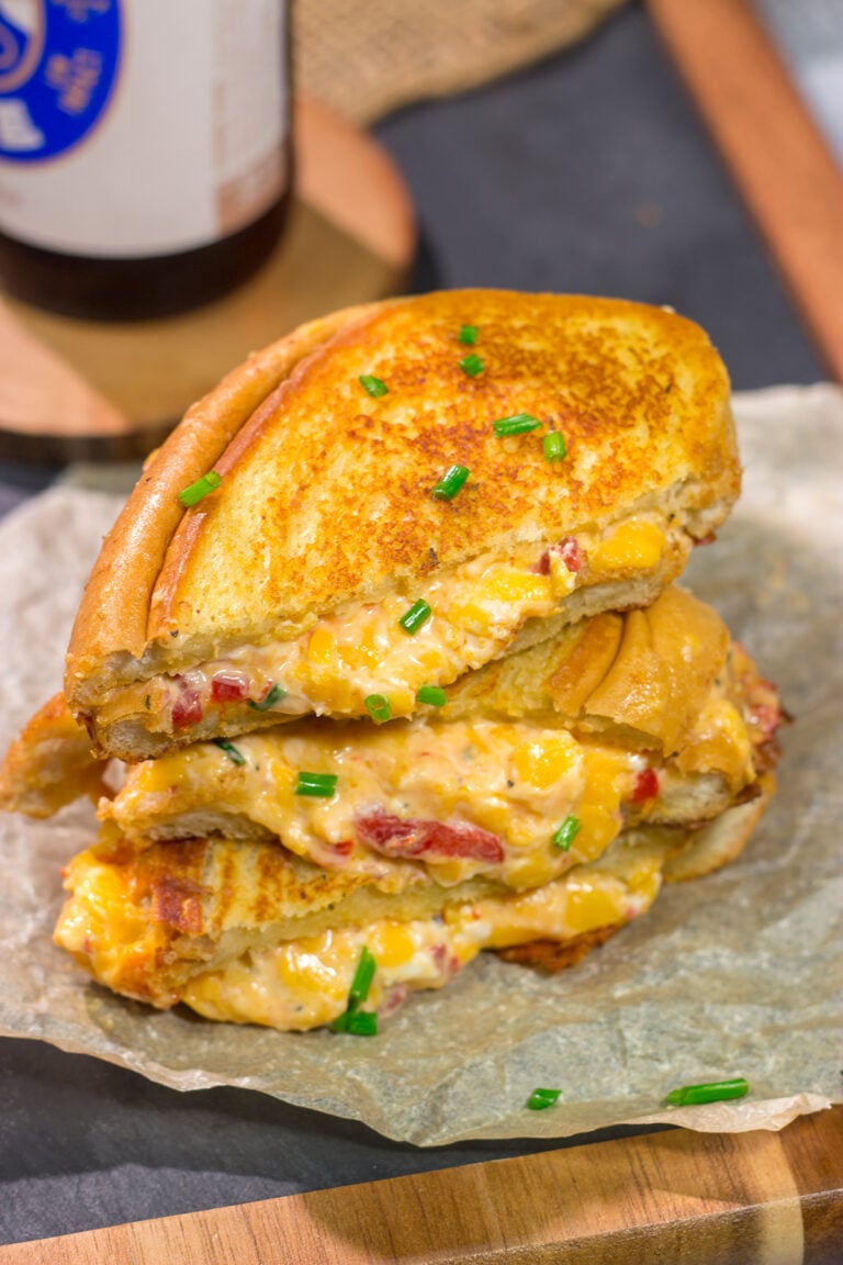 Take an old classic to a new level! These Pimento Grilled Cheese Sandwiches feature melty, creamy pimento cheese in between slices of buttered bread. Yum!