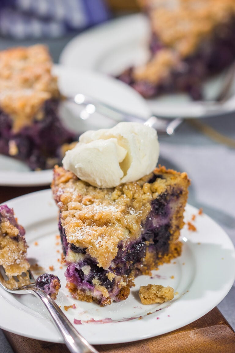 Featuring a sweet custard poured over juicy blueberries, this Blueberry Cream Pie is packed with summer flavor! Grab a slice and enjoy!