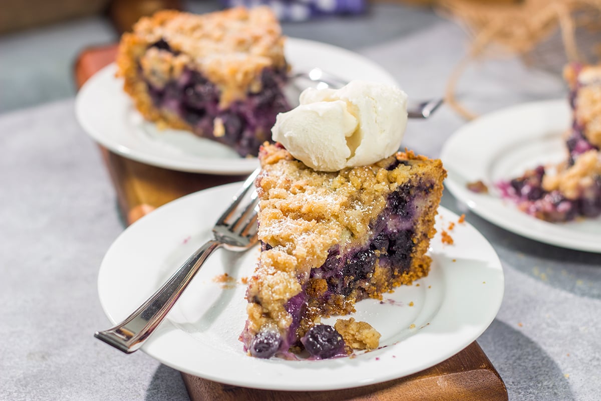 Featuring a sweet custard poured over juicy blueberries, this Blueberry Cream Pie is packed with summer flavor! Grab a slice and enjoy!
