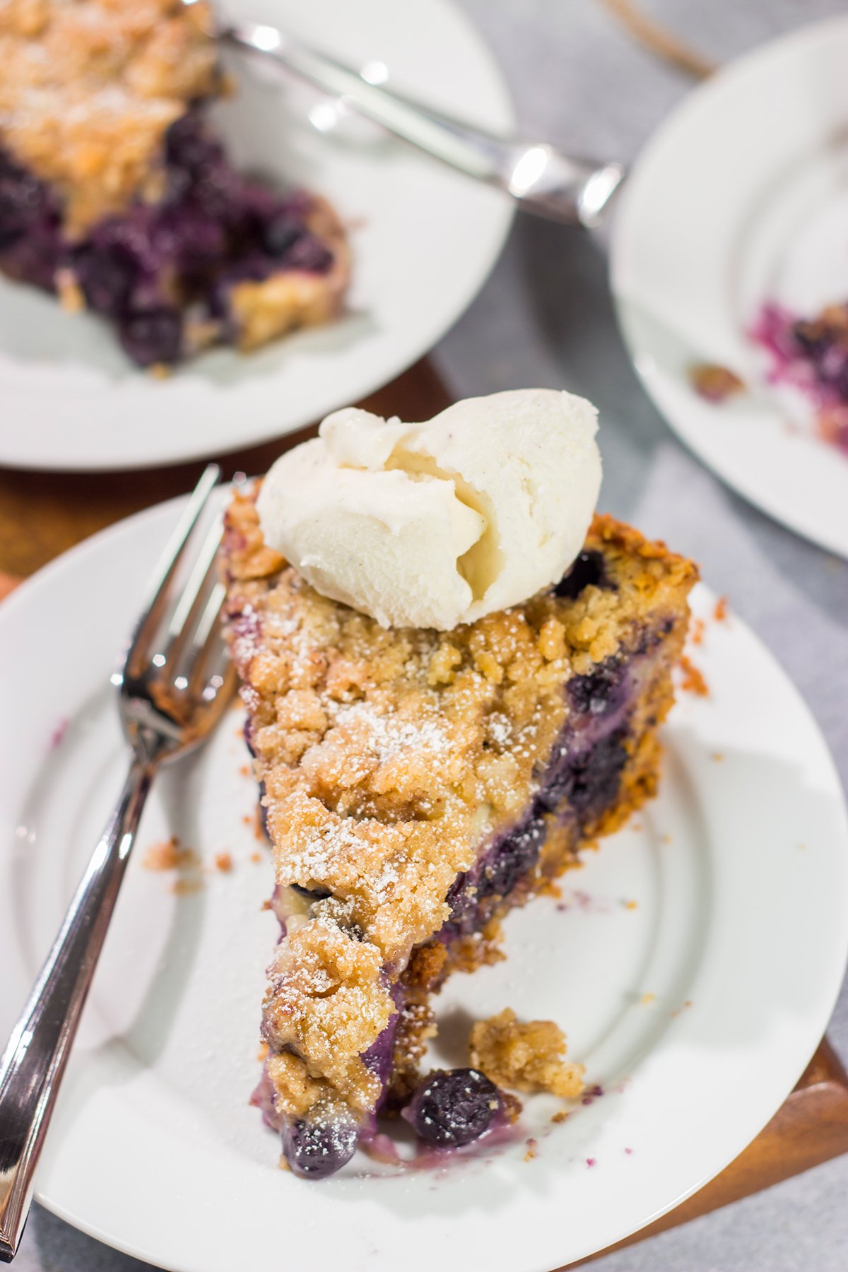 Featuring a sweet custard poured over juicy blueberries, this Blueberry Cream Pie is packed with summer flavor! Grab a slice and enjoy!
