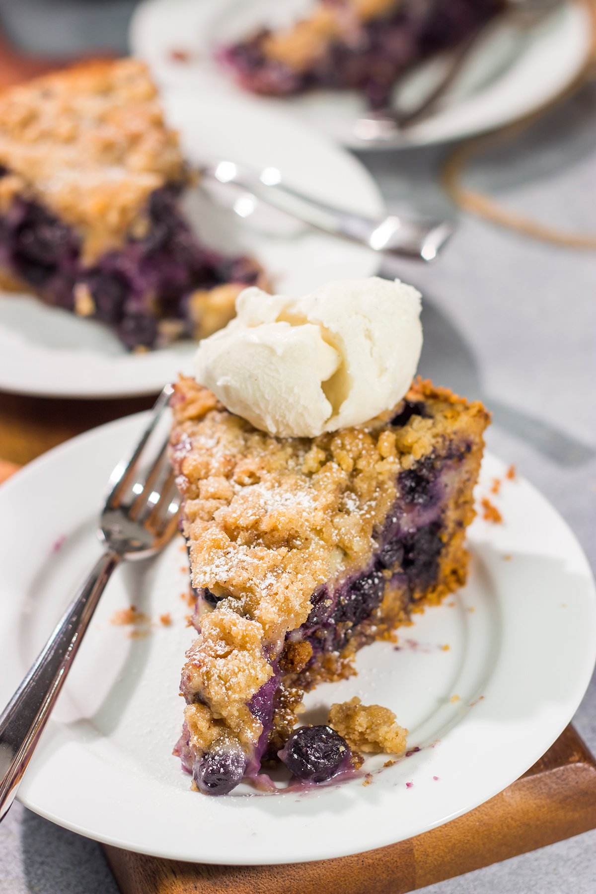 Featuring a sweet custard poured over juicy blueberries, this Blueberry Cream Pie is packed with summer flavor! Grab a slice and enjoy!