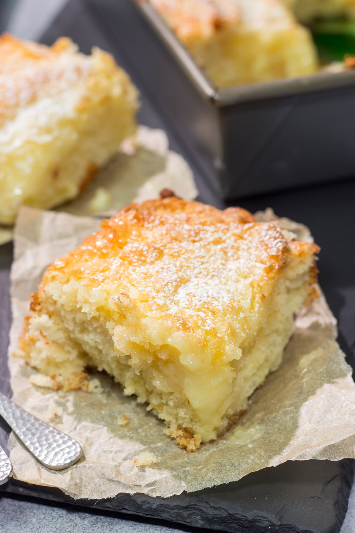 A classic St. Louis dessert, a Gooey Butter Cake features a buttery cake base topped with a vanilla cream cheese layer - it is absolutely addicting! Say hello to your new favorite dessert!