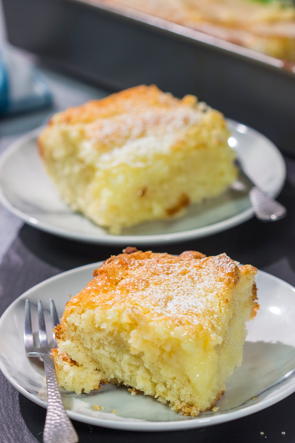 A classic St. Louis dessert, a Gooey Butter Cake features a buttery cake base topped with a vanilla cream cheese layer - it is absolutely addicting! Say hello to your new favorite dessert!