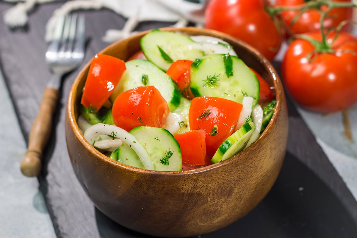 This easy Tomato, Cucumber and Onion Salad is a delicious summer recipe! This versatile side dish pairs well with almost anything.