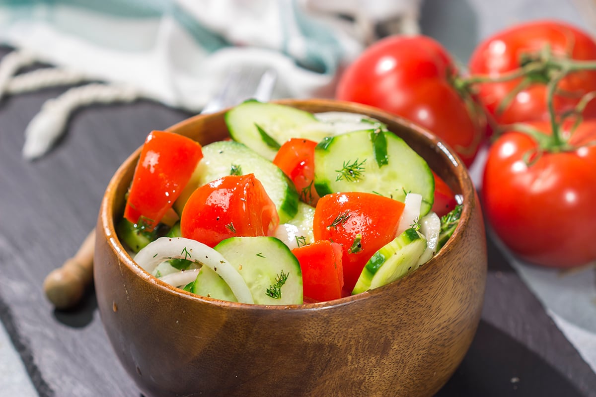 This easy Tomato, Cucumber and Onion Salad is a delicious summer recipe! This versatile side dish pairs well with almost anything.