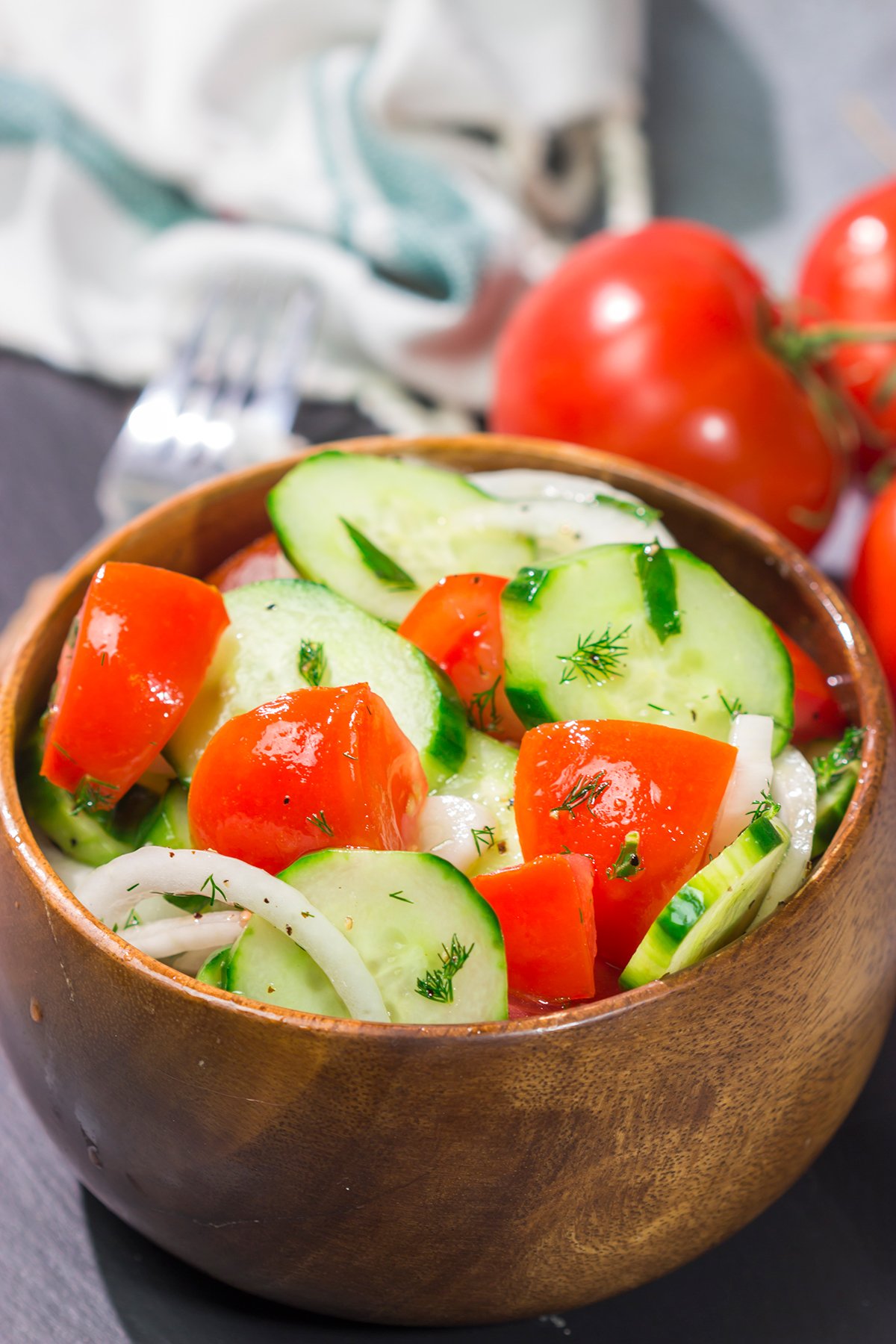 This easy Tomato, Cucumber and Onion Salad is a delicious summer recipe! This versatile side dish pairs well with almost anything.