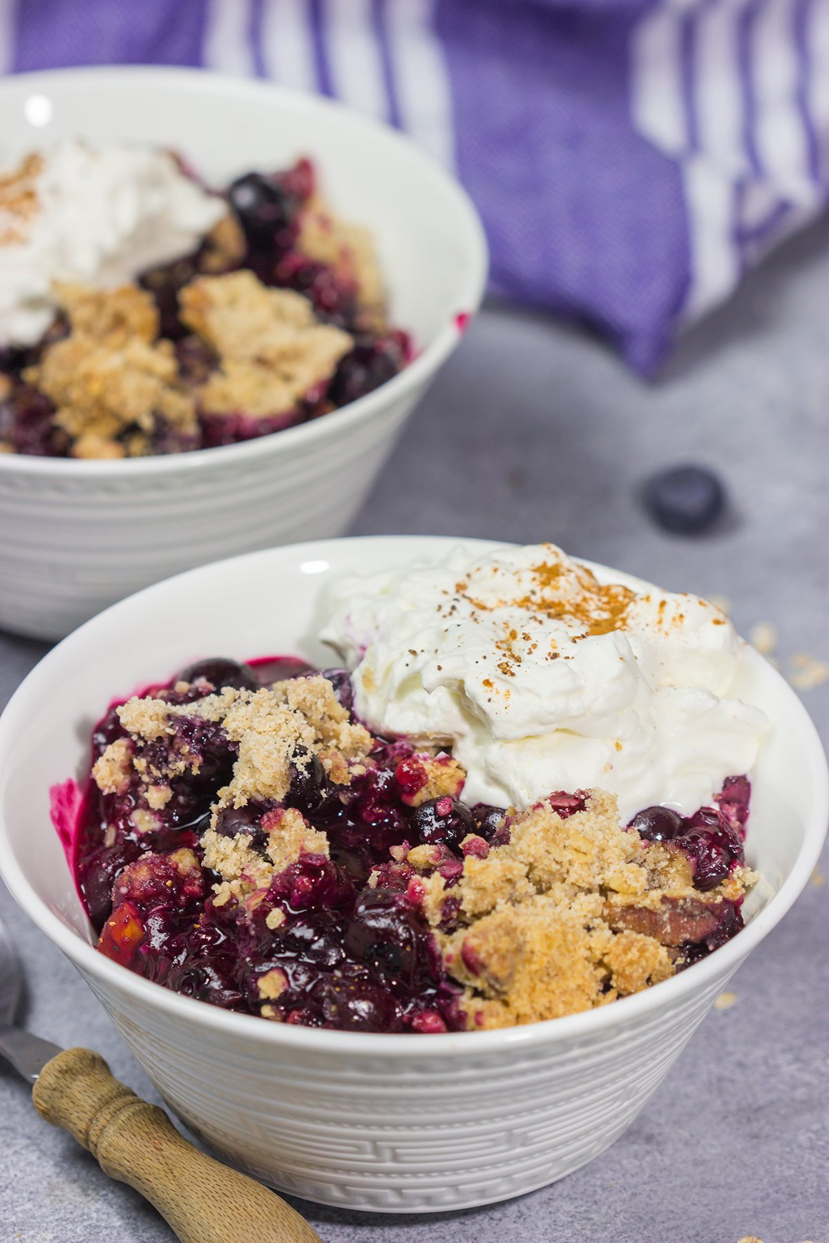 This classic Blueberry Crisp recipe features a juicy berry filling topped with a crispy oat streusel. It's the perfect dessert for warm summer evenings!