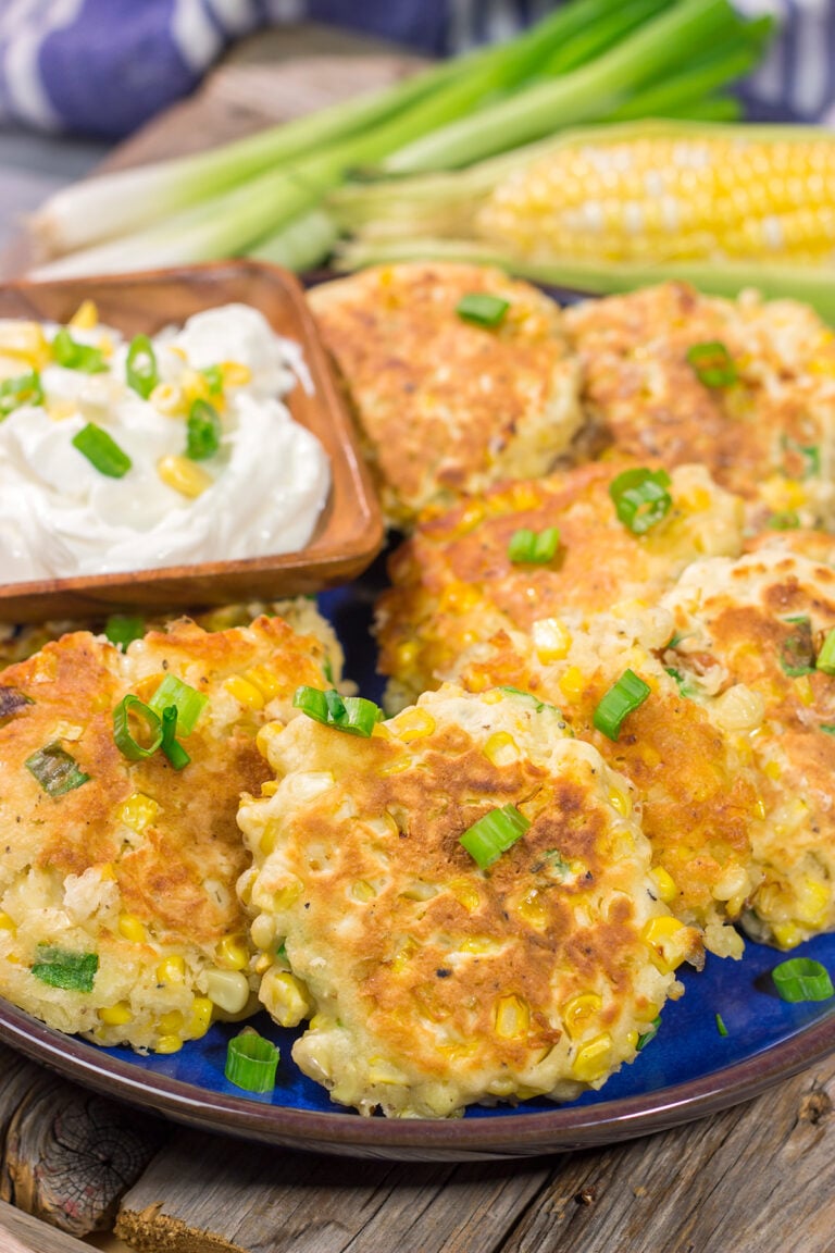 These Corn Fritters feature fresh corn kernels mixed into a simple batter. Serve with a side of sour cream for a delicious summer side dish or appetizer!