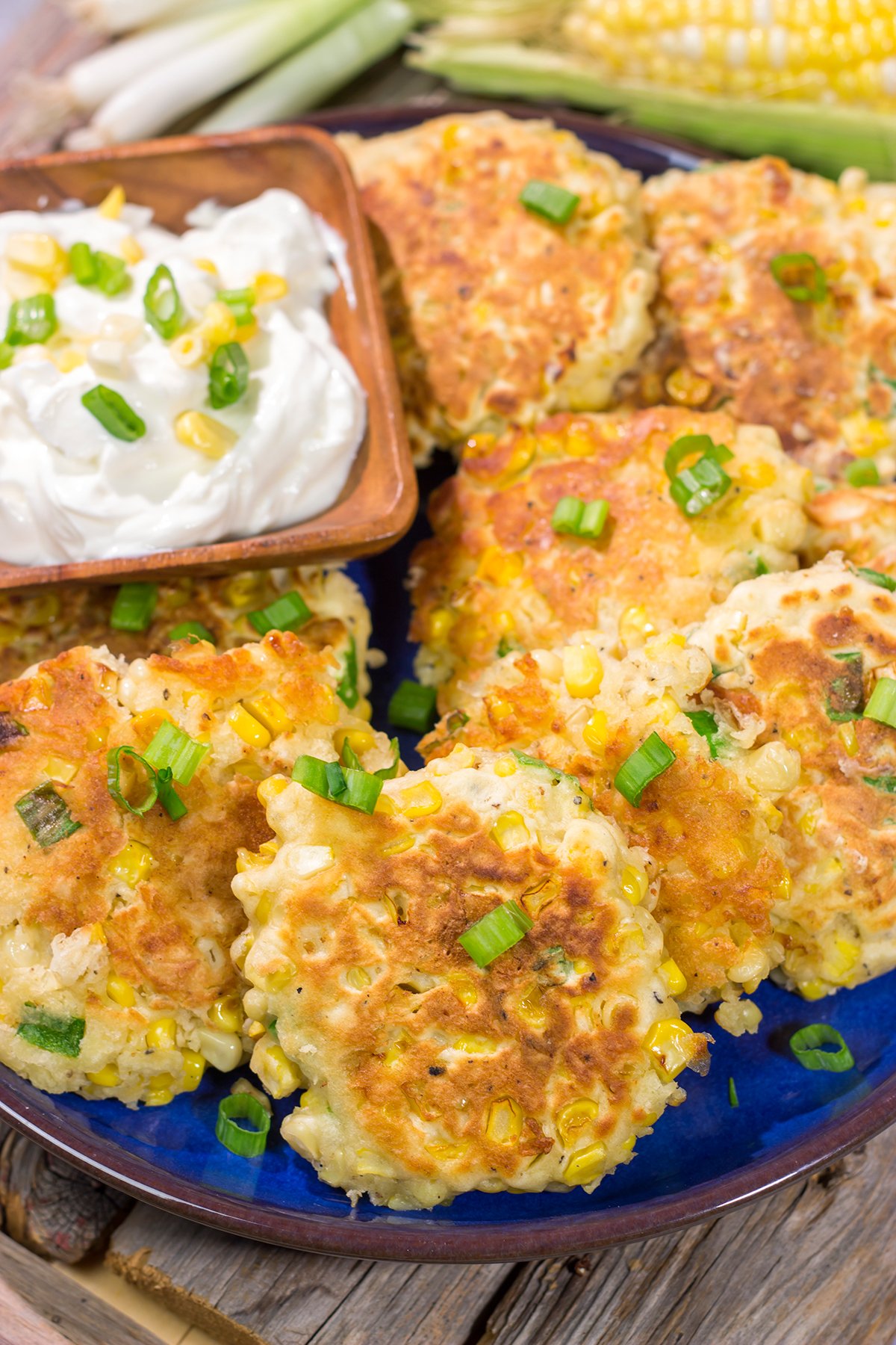 These Corn Fritters feature fresh corn kernels mixed into a simple batter. Serve with a side of sour cream for a delicious summer side dish or appetizer!