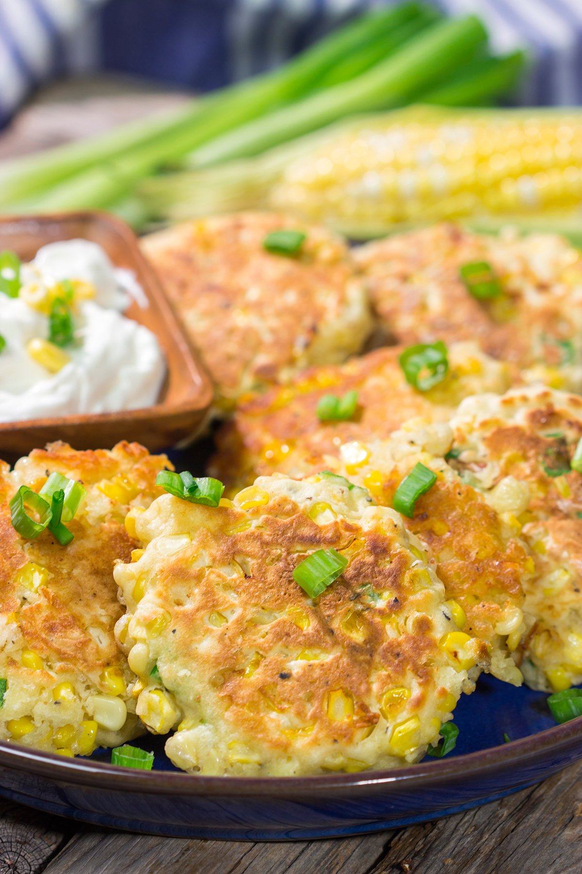 These Corn Fritters feature fresh corn kernels mixed into a simple batter. Serve with a side of sour cream for a delicious summer side dish or appetizer!