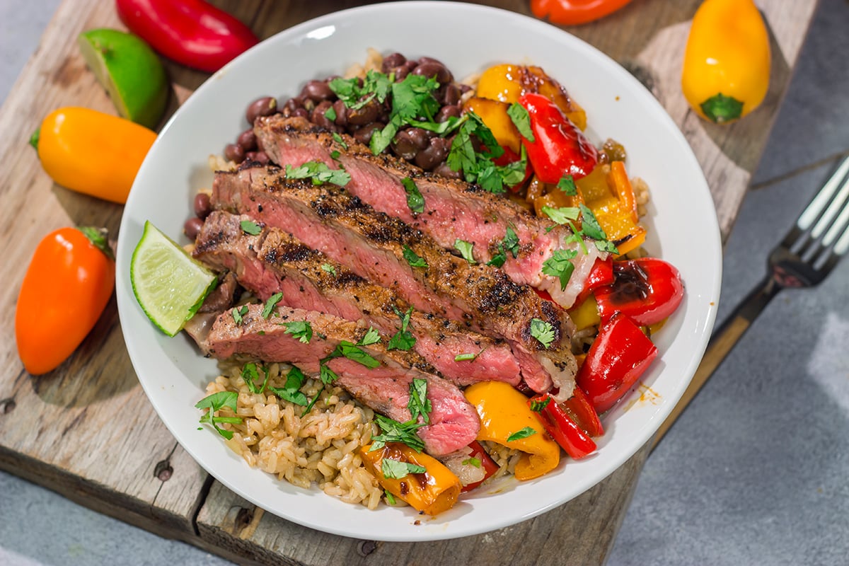 These Grilled Steak Burrito Bowls are packed with summer flavor, but they're easy enough to make on a weeknight. Happy Grilling!