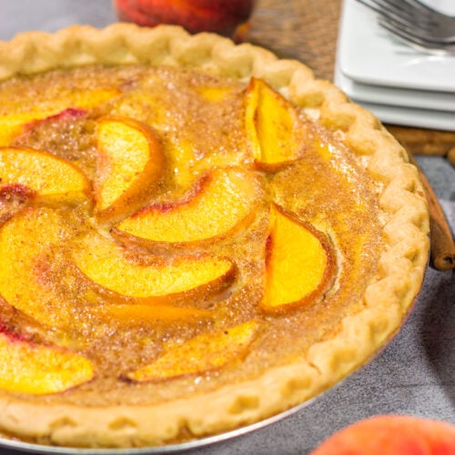 This Peaches and Cream Pie is a fun nod to the old-fashioned dessert of sliced peaches with fresh cream. The flavor of the fresh peaches makes this the perfect summer dessert recipe!