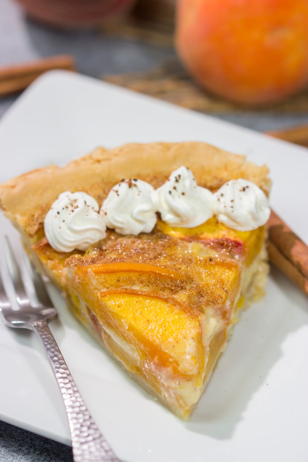 This Peaches and Cream Pie is a fun nod to the old-fashioned dessert of sliced peaches with fresh cream. The flavor of the fresh peaches makes this the perfect summer dessert recipe!