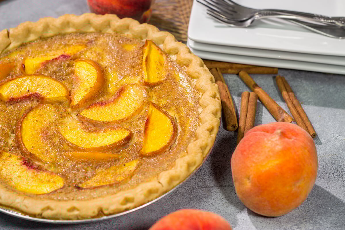 This Peaches and Cream Pie is a fun nod to the old-fashioned dessert of sliced peaches with fresh cream. The flavor of the fresh peaches makes this the perfect summer dessert recipe!