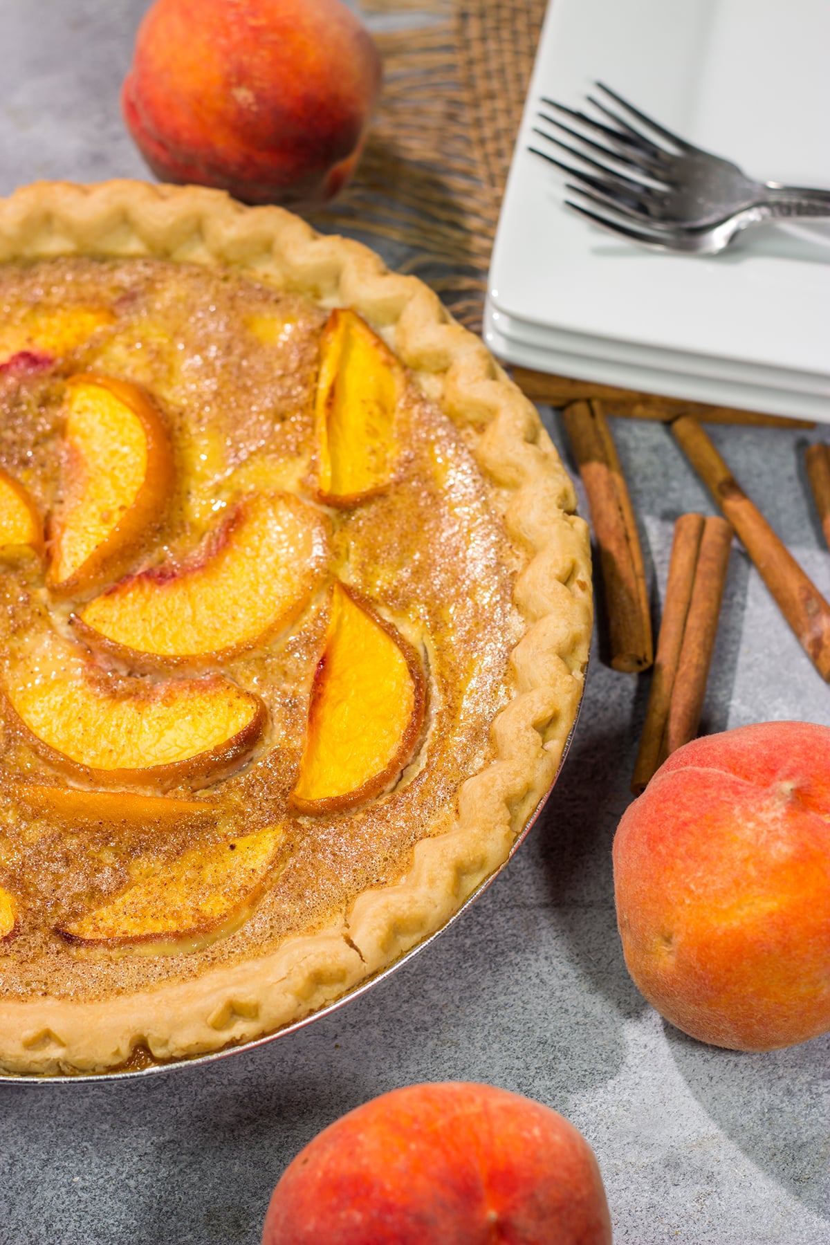 This Peaches and Cream Pie is a fun nod to the old-fashioned dessert of sliced peaches with fresh cream. The flavor of the fresh peaches makes this the perfect summer dessert recipe!