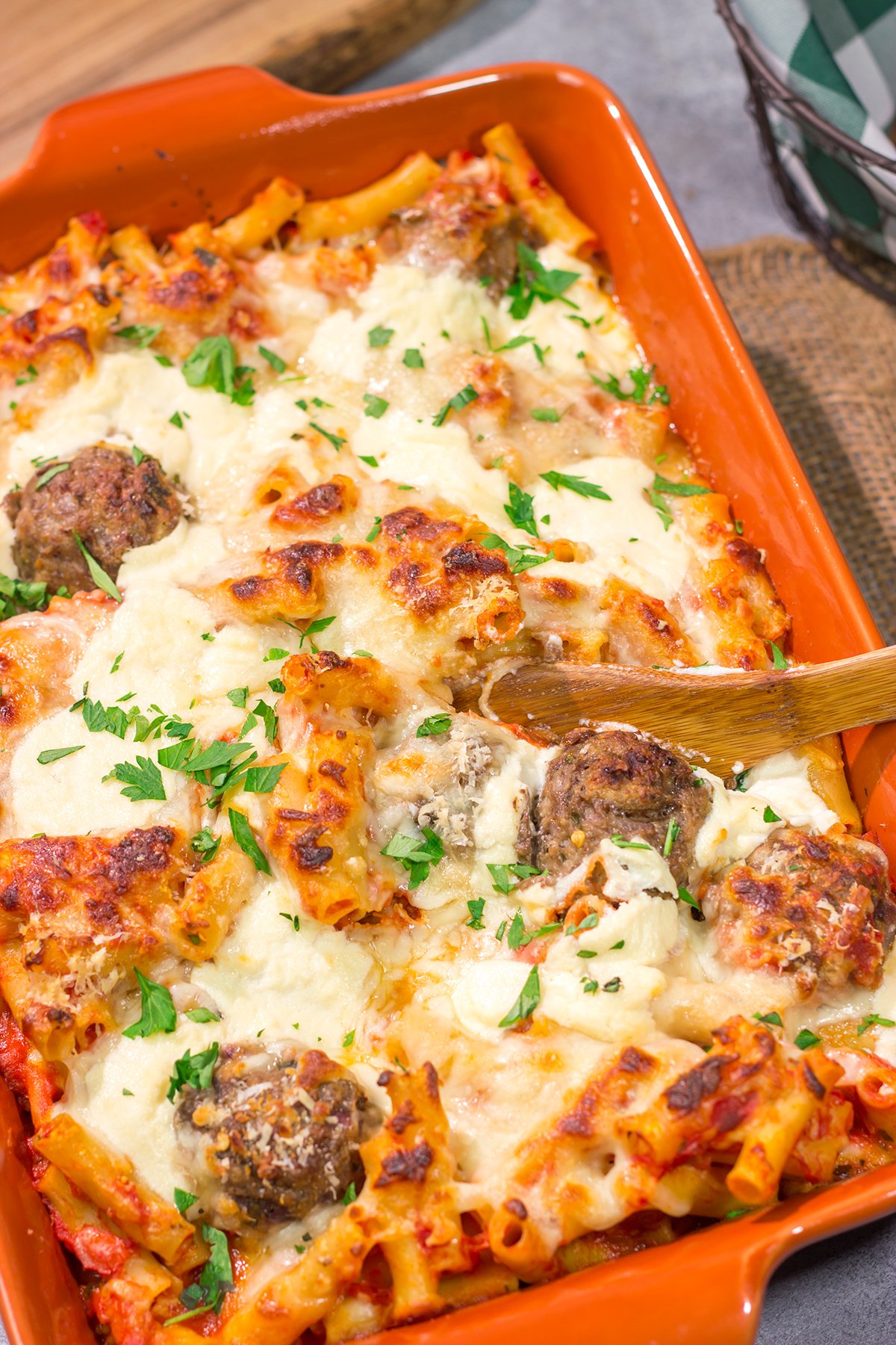 This Baked Ziti with Meatballs recipe is the ultimate comfort food. Pasta, gooey melted cheese and meatballs combine to create a delicious casserole!