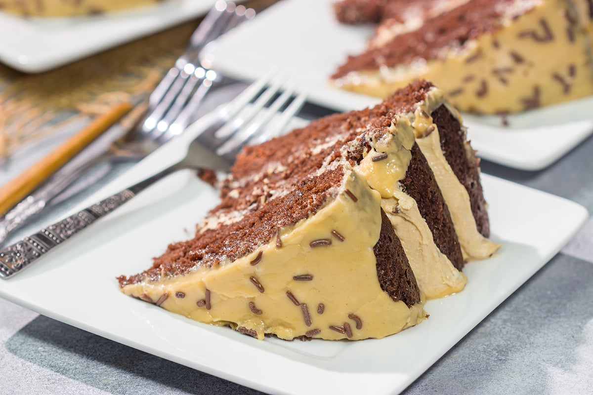 This Chocolate Cake with Peanut Butter Ganache features a chocolate layer cake filled with creamy peanut butter ganache. It's sure to be a new favorite dessert!
