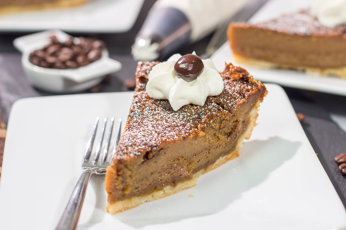 Love the flavor of coffee? Then this dessert is calling your name! This Coffee Chess Pie features a creamy coffee custard in a flaky pie shell. Grab a fork and dig in!