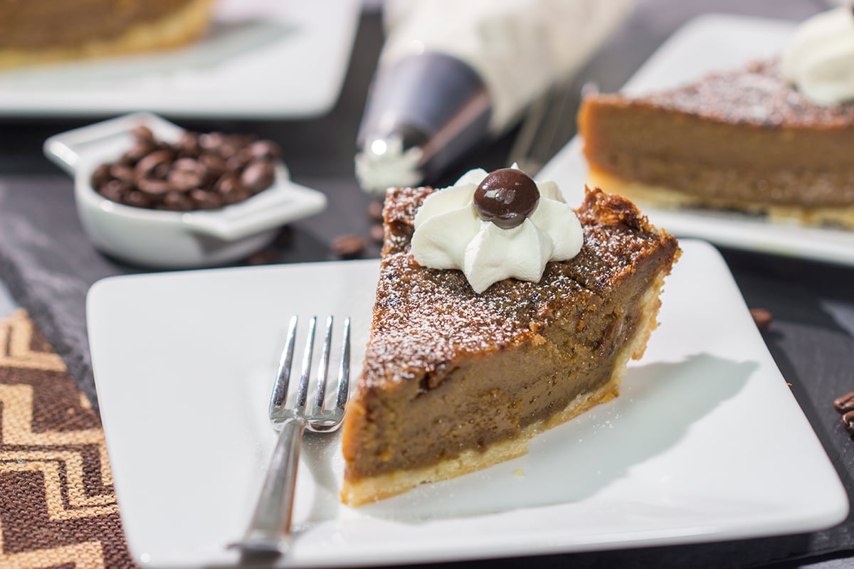 Love the flavor of coffee? Then this dessert is calling your name! This Coffee Chess Pie features a creamy coffee custard in a flaky pie shell. Grab a fork and dig in!