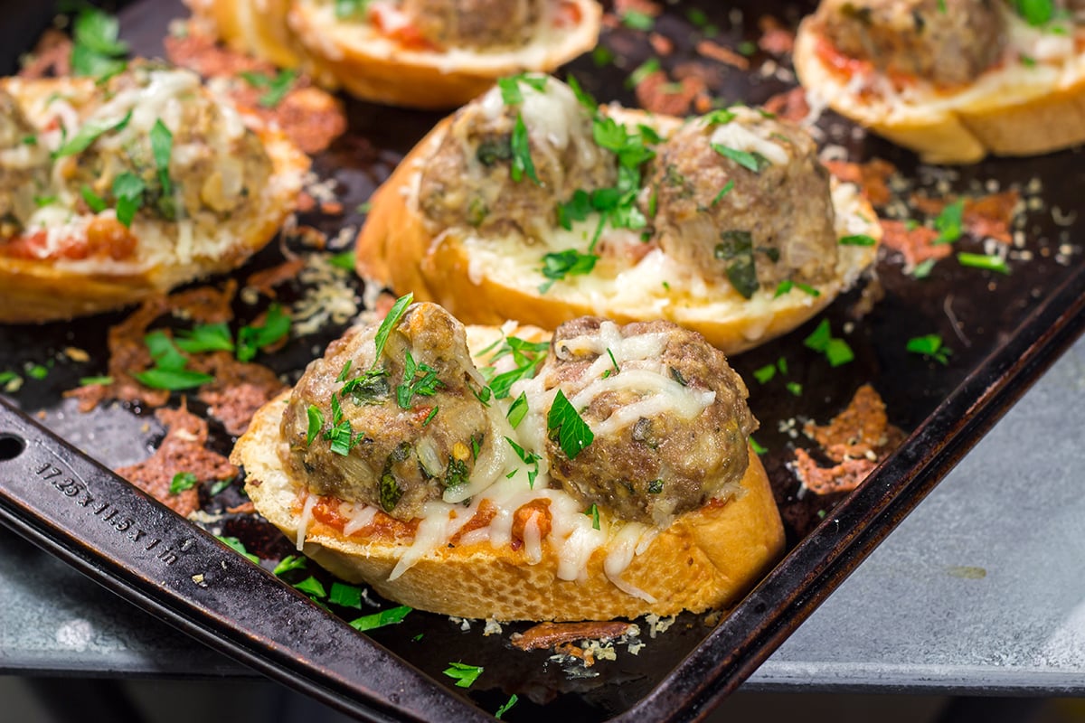 These delicious Open Faced Meatball Sandwiches are the ultimate comfort food! This recipe is an easy dinner idea but it's also great for feeding a crowd on gameday.