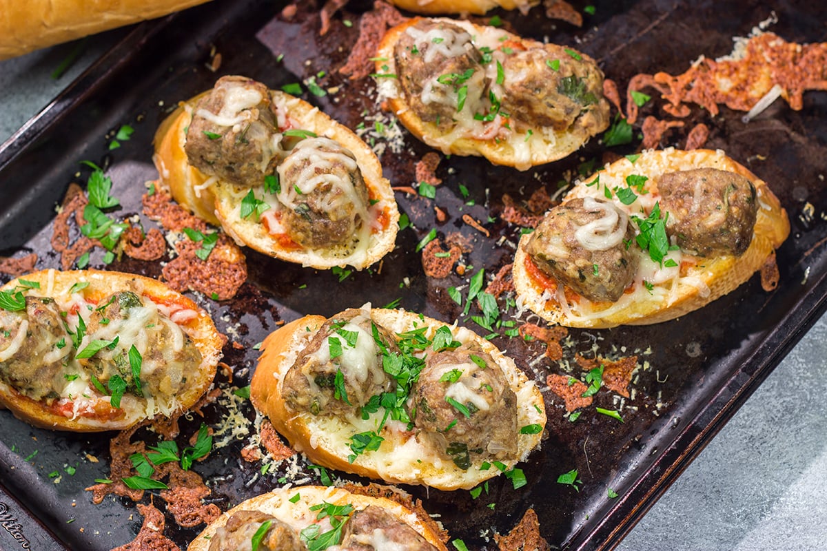 These delicious Open Faced Meatball Sandwiches are the ultimate comfort food! This recipe is an easy dinner idea but it's also great for feeding a crowd on gameday.