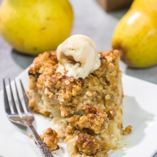 Sweet pears get tossed with a sour cream pie filling for a delicious and easy autumn dessert. This Pear Crumble Pie also gets topped with a brown sugar crumble - delicious!