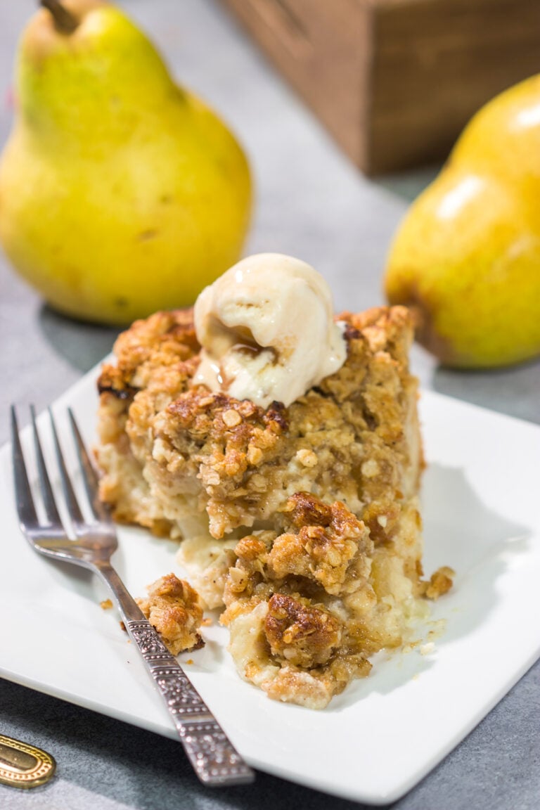 Sweet pears get tossed with a sour cream pie filling for a delicious and easy autumn dessert. This Pear Crumble Pie also gets topped with a brown sugar crumble - delicious!