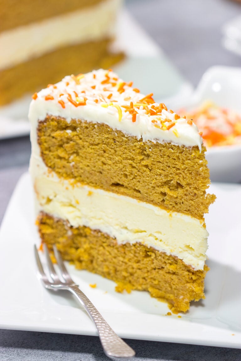 This Pumpkin Spice Cheesecake Cake features a layer of cheesecake sandwiched in between 2 layers of pumpkin spice cake. It's a delicious autumn dessert!