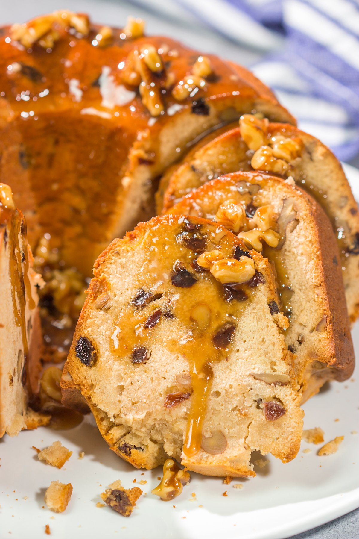 This Rum Raisin Pound Cake features a buttery cake studded with raisins and chopped walnuts. For extra flavor, a warm rum sauce gets poured over the cake before serving.