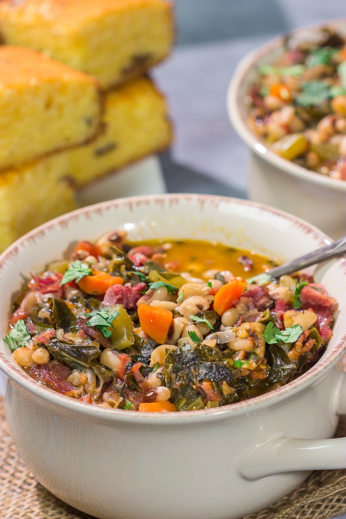 A bowl of this Black Eyed Pea Soup is sure to bring good luck - and it's delicious! Serve this hearty soup with a hunk of warm, buttered cornbread for the ultimate cozy meal.