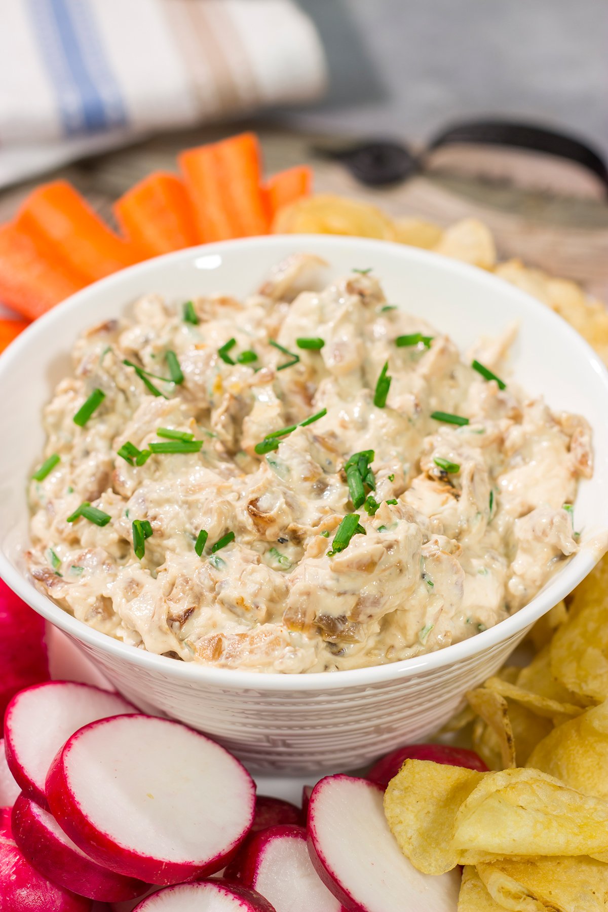This Caramelized Onion Dip is the perfect party appetizer! Grab some crackers, veggies and chips and get ready to dig into this classic dip!